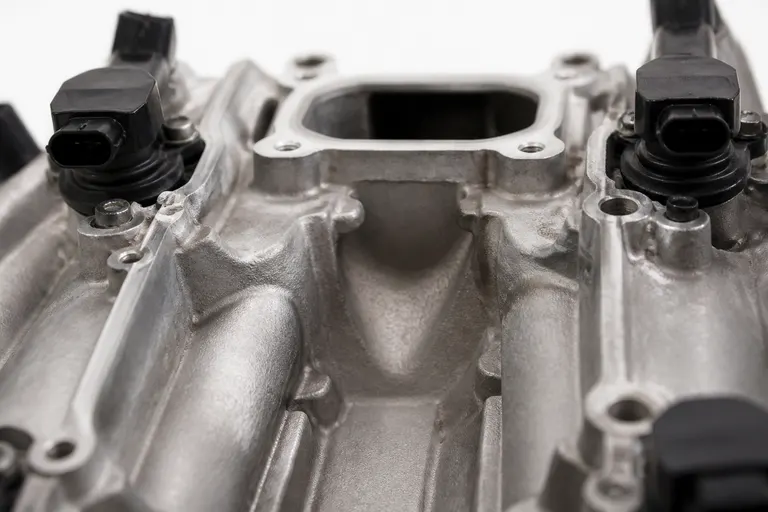 Close-up of the center valley between the cylinder banks of a V8 engine